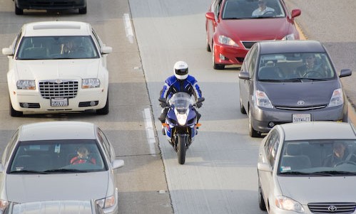 motorcycle driving between lanes